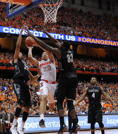 Brandon Triche goes up for a layup against Moses Ayegba.