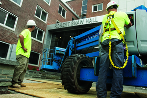 (FROM LEFT) Erik Mott and Forrest Todd, employees of Lemoyne Interiors Inc., work on renovations to the Euclid Avenue side of Shaw Hall. After four summers, four phases and extensive makeovers and repairs all around, planned renovations to Shaw Hall were completed this summer.