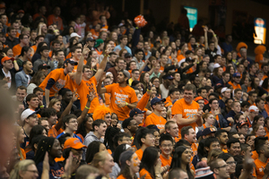 Syracuse fans cheer on the Orange basketball teams in the Carrier Dome on Friday night.