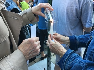 Attendees of CNY Pride's Syracuse vigil lit candles last Monday for the victims of the Orlando shooting.