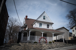 Greek letters were removed from what was the Theta Tau fraternity house. 