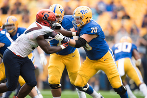 Kingsley Jonathan battles with a Pitt offensive lineman.