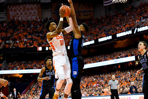 Oshae Brissett gets met at the rim by Duke forward Javin DeLaurier.