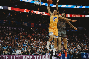 Pittsburgh guard Trey McGowens elevates for a slam in the Panthers' game against Boston College Tuesday.