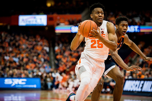 Tyus Battle drives to the hoop in Syracuse's home finale against Virginia.