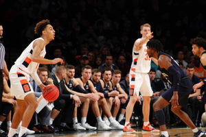 Brycen Goodine (left) didn't tally a point in nine minutes for the Orange, but turned the ball over twice.