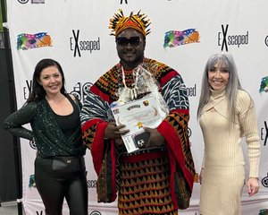 Michelle DiBernardo, Witty Minstrel and Linda Osborne (left to right) celebrate Minstrel’s award at the end of the ceremony. Minstrel received the Documentary Award. 