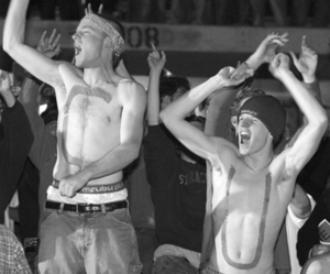 Mike Flynn (C) and Chris Collins (U) cheer at the Carrier Dome as Syracuse beat Kansas on Monday to win its first national title.