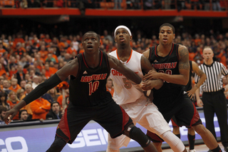 C.J. Fair muscles for position against Gorgui Dieng and Chane Behanan. Fair finished with six rebounds and 19 points in the loss.