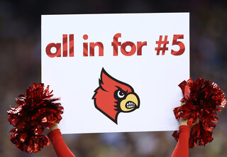 A Louisville cheerleader holds up a sign for Kevin Ware.