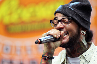 Lead singer Travis McCoy of Gym Class Heroes performs before the All Star Game during the Final Four 2013 NCAA Men's Basketball Tournament.