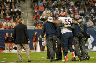 Rob Trudo is helped off the field after suffering an injury.