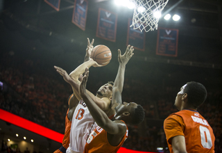 Cavaliers forward Anthony Gill gets blocked on his layup attempt over Rakeem Christmas. 