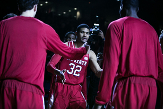 N.C. State forward Kyle Washington interacts with his teammates as his name is announced. 