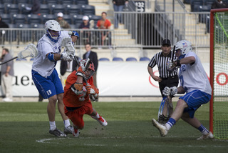 Kevin Rice takes a shot on Luke Aaron of Duke. Rice finished with three goals in the game.