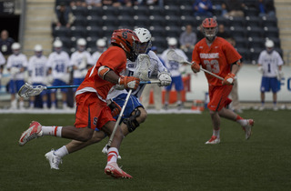 Hakeem Lecky moves down the right alley while a Duke defender gives chase. 