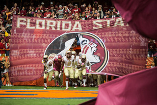 Florida State floods out of the tunnel ahead of a noon kickoff at the Carrier Dome on Saturday afternoon. 