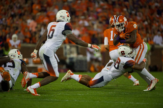 Lynch makes a tackle as Ritchy Desir looks on. 