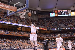 Joseph goes up for a finger roll as HC guard Justin Burrell watches.