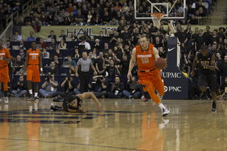 Cooney attacks in transition as two Pittsburgh defenders lag behind. He was 3-for-12 from the field in his 38 minutes on the court.