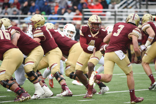 BC quarterback Darius Wade hands off to Michael Walker.