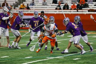 The Albany defense surrounds a Syracuse player.